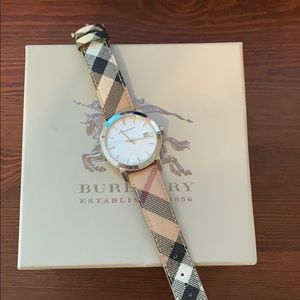 Burberry watch with plaid strap and silver face